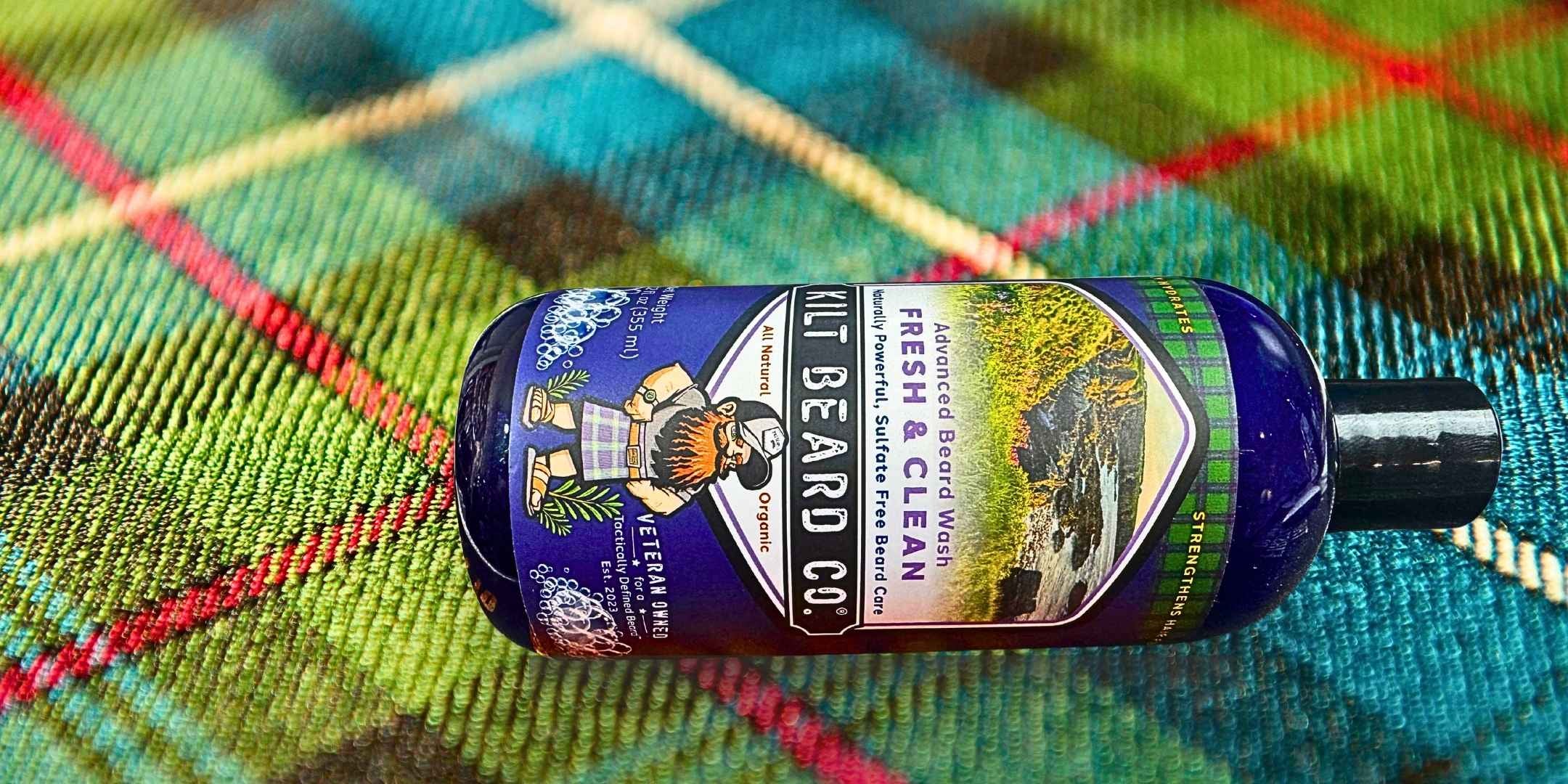 Kilt Beard Co.- Advanced Beard Wash, Fresh and Clean 12oz bottle resting on a heritage tartan.